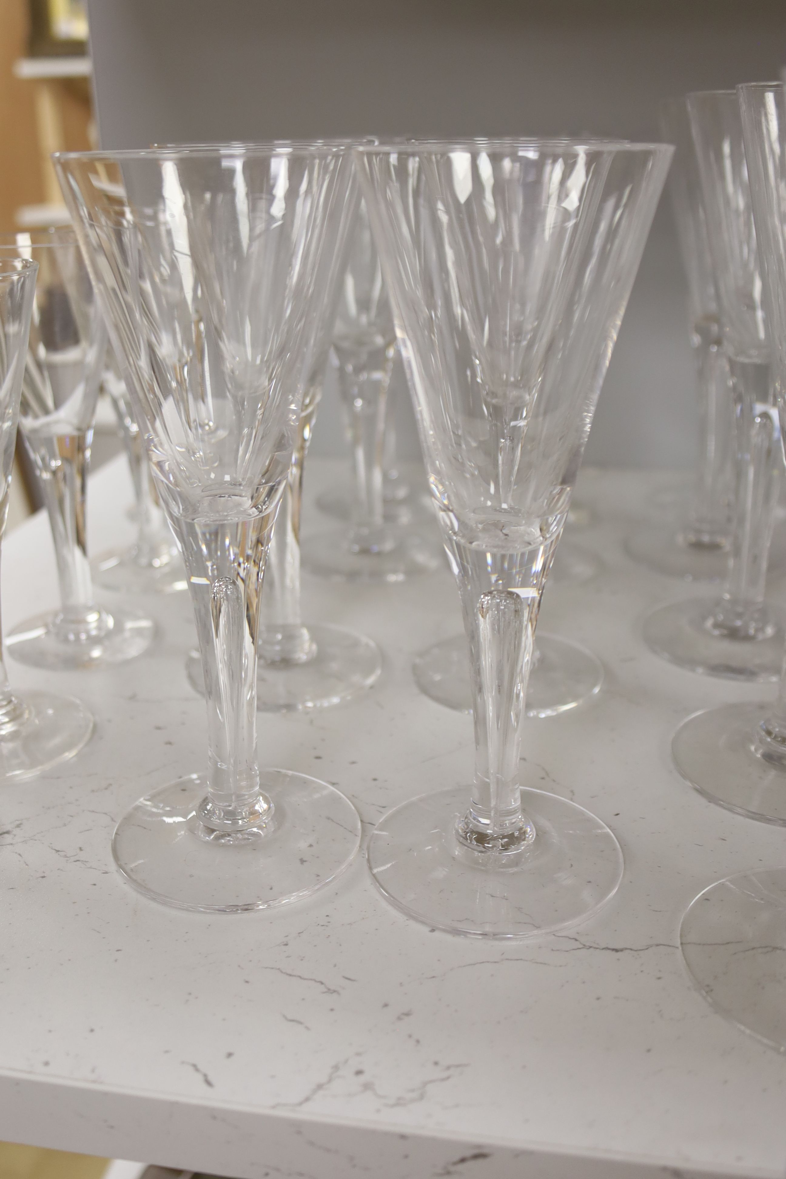 A collection of nine Darlington Sharon designed sherry glasses with four matching candlesticks